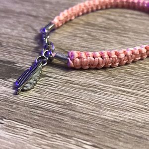 Peach ribbon and silver feather bracelet